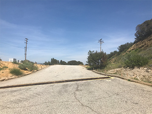 This photo shows the former location of the Alfa LOX tank, the only remnants being dirt, hydroseed, and straw wattles to prevent erosion.