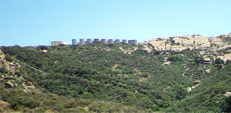 This photo shows the Skyline area in March 2016, just before demolition work began. Ten water tanks can be seen on the top of a hill in the distance.