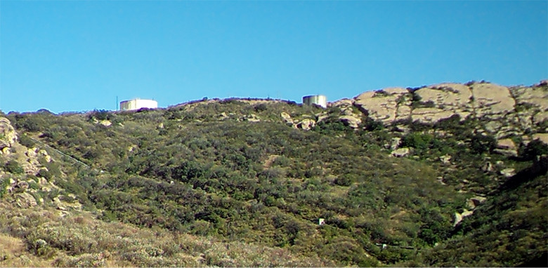 This photo shows the Skyline area in July 2016, after significant progress with demolition work. Just two water tanks can be seen on the top of a hill in the distance.
