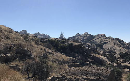 This photo shows a portion of Area II with the Coca Test in the background and brush and grass regrowth following the November Woolsey Fire.